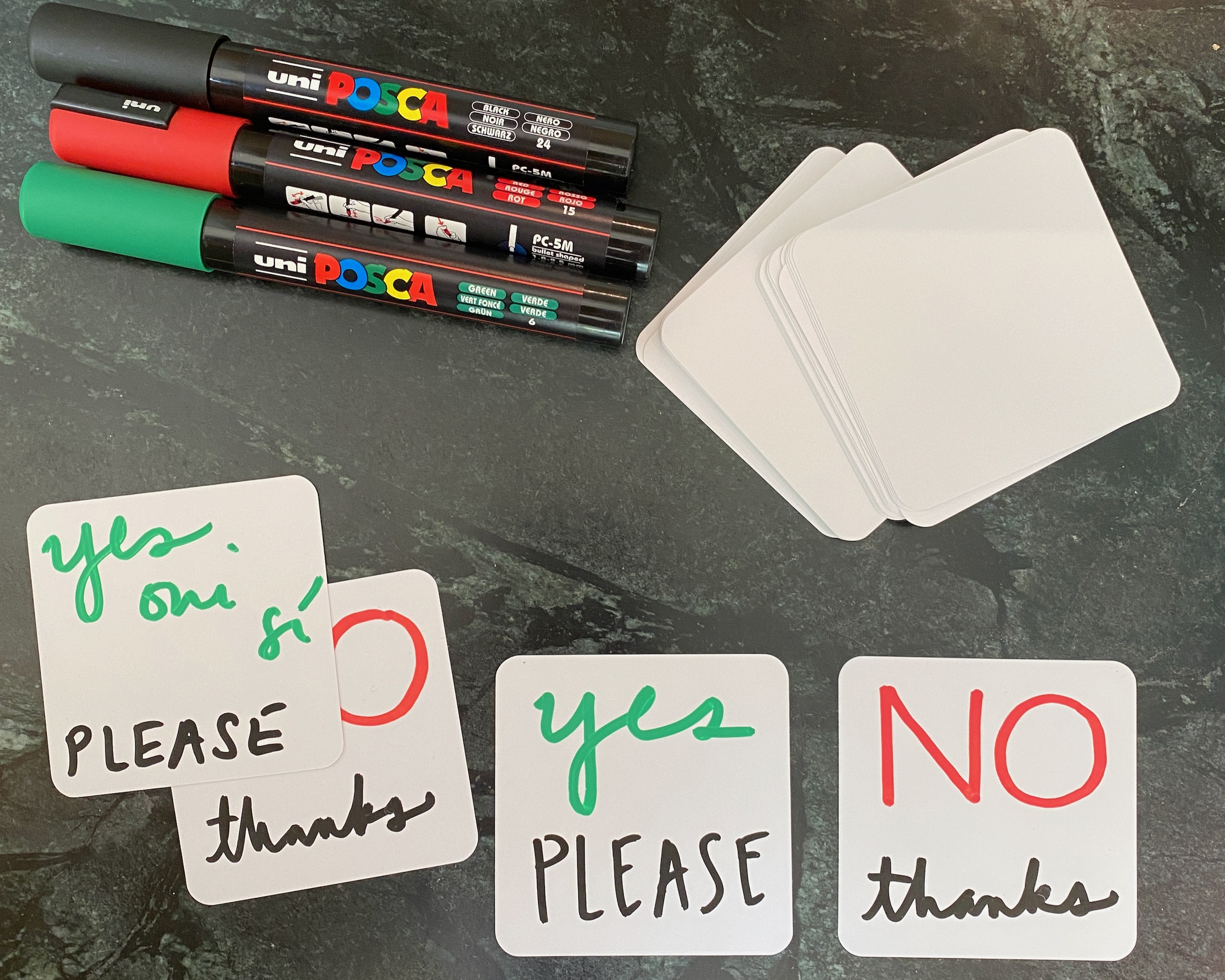 Consent cards: white playing cards with handwritten "yes please" and "no thanks" are shown, along with blank cards and paint pens.