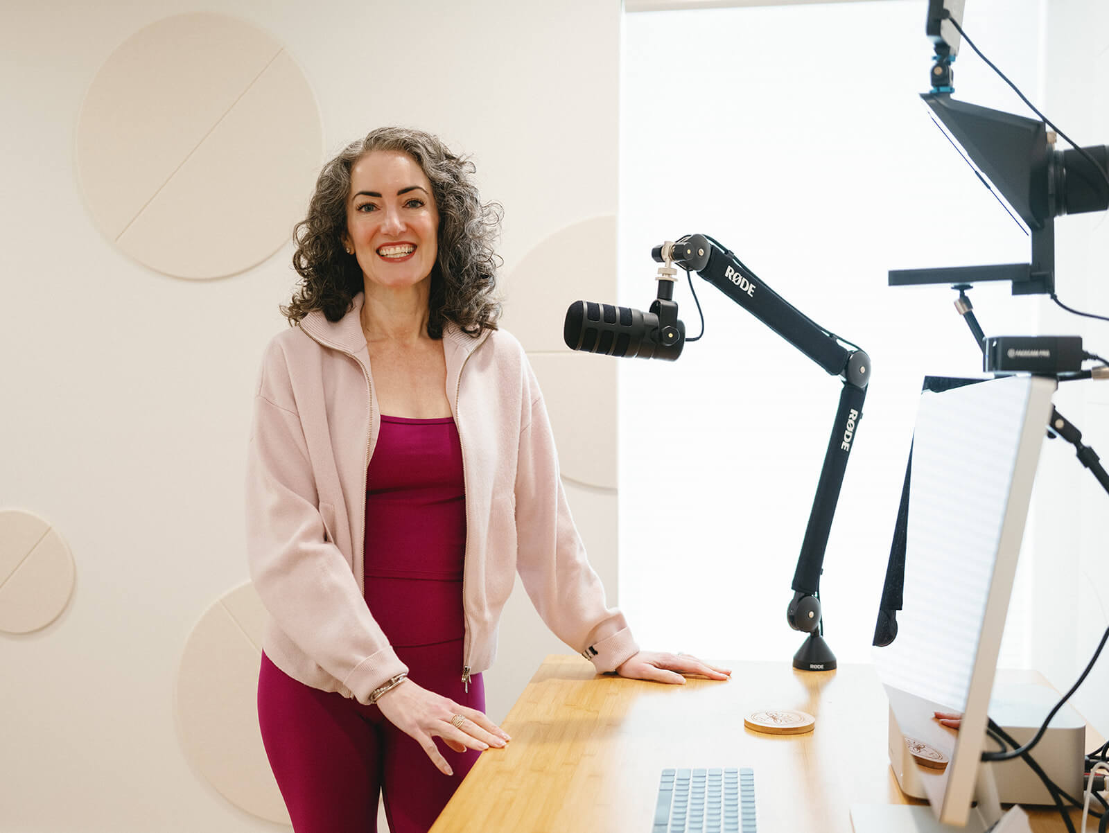 Sage Rountree | Yoga Podcast Host Sage Rountree stands at her desk ready to record the Yoga Teacher Confidential podcast
