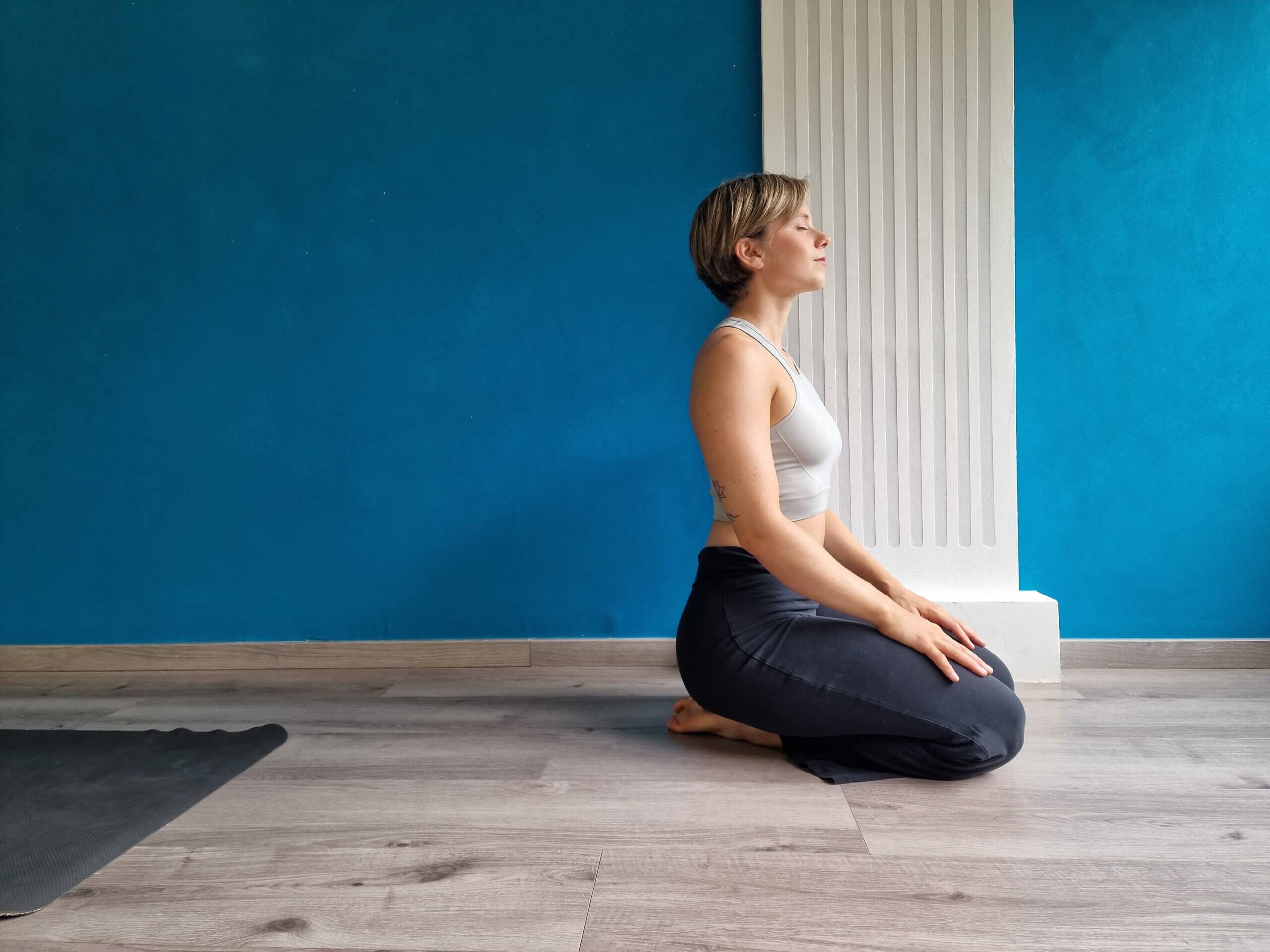 Sofia-Gobbi-yoga-for-athletes-header Sofia Gobbi kneels on the floor of a yoga studio