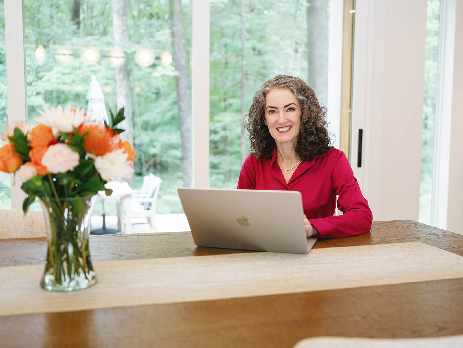 Sage Rountree | Lifestyle Sage Rountree writes Sage Advice, a newsletter for yoga teachers, on her laptop