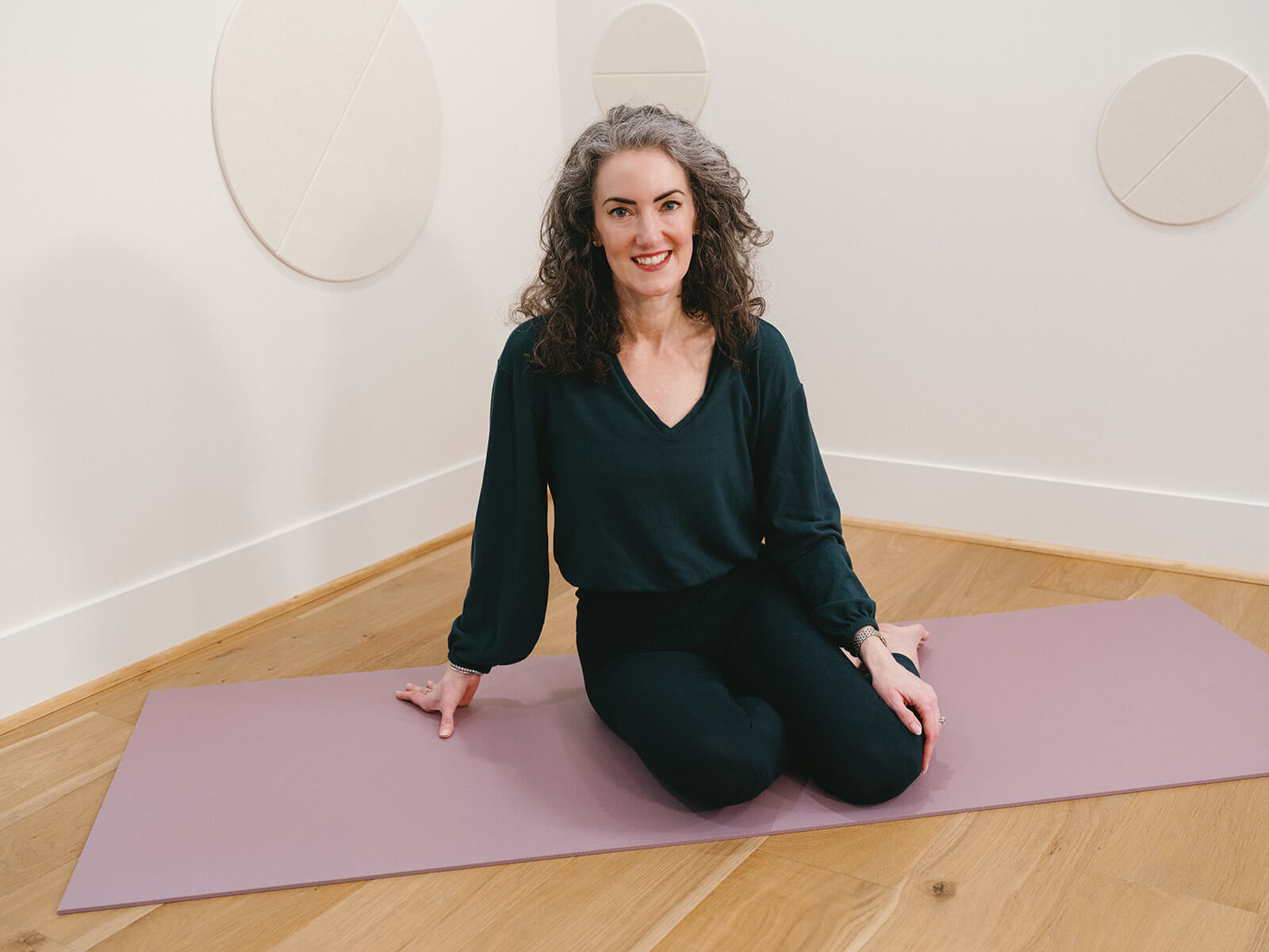 Sage Rountree, yoga teacher trainer and mentor, in her studio